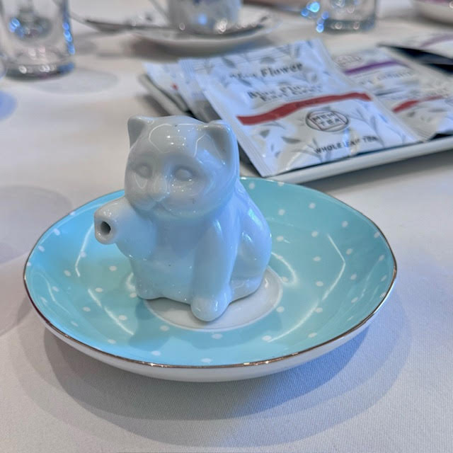 White kitten-shaped creamer at the NYBG Wonderland afternoon tea.