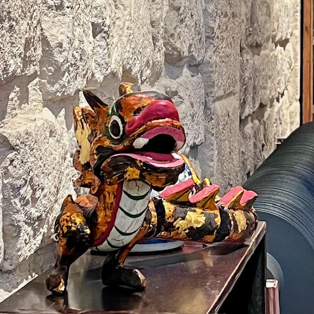 Colorful dragon sculpture inside Wistaria Paris Tea House