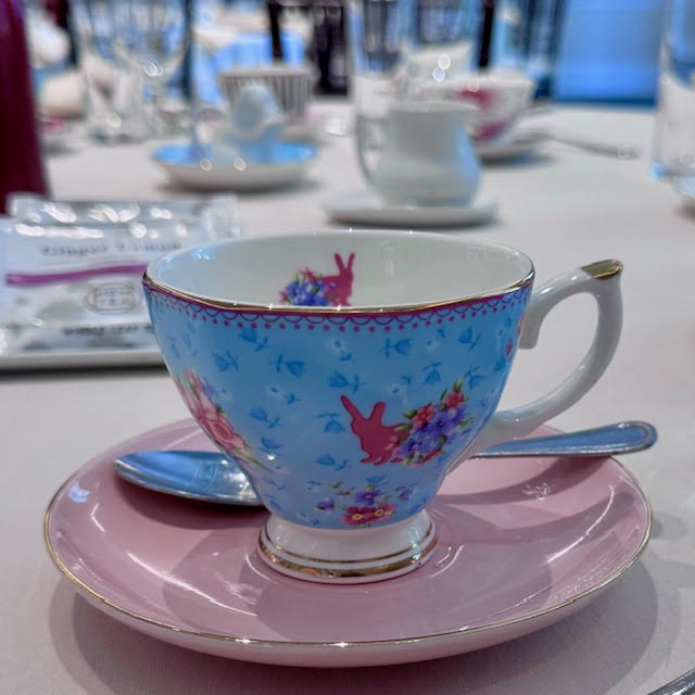 Blue teacup with the silhouette of pink bunnies at the NYBG Wonderland afternoon tea.