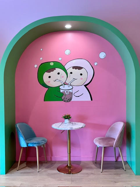 One of the pink and green nooks for enjoying your bubble tea at Tea Magic in Williston Park, NY.