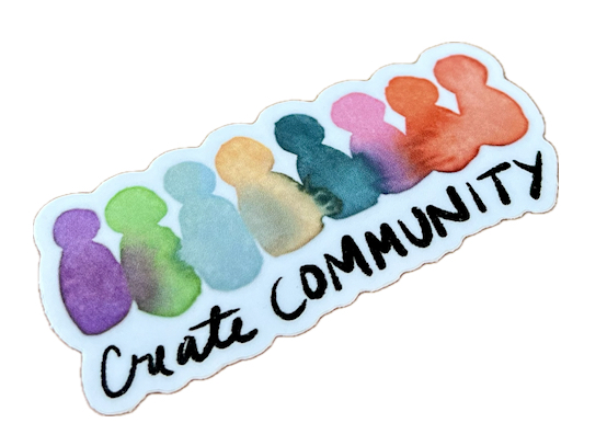 colorful sticker that says "create community"