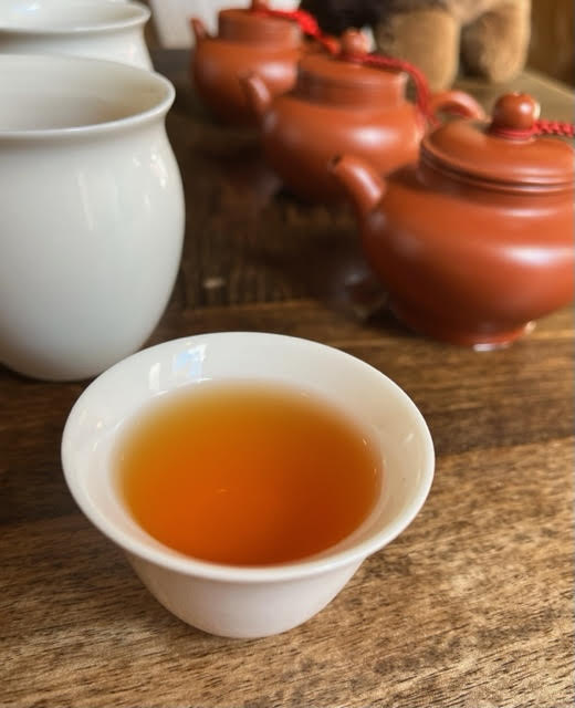 Photo of teacup, clay teapots, and fairness pitchers at Té Company in the West Village of Manhattan--a favorite place to have top tea experiences in 2024.