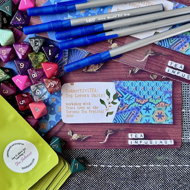 Items Traci Levy used presenting at the Toronto Tea Festival--tea-prompt cards, 8-sided die, pens, and empty food storage bags to share tea.